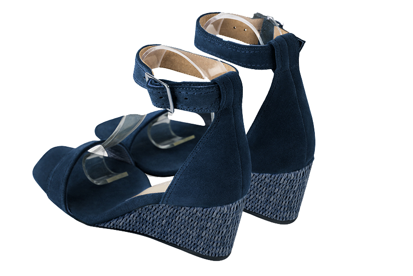 Navy blue women's closed back sandals, with a strap around the ankle. Square toe. Medium wedge heels. Rear view - Florence KOOIJMAN